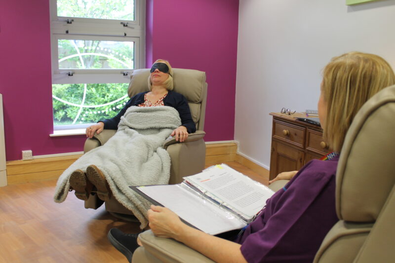 Staff with a patient doing clinical hypnotherapy