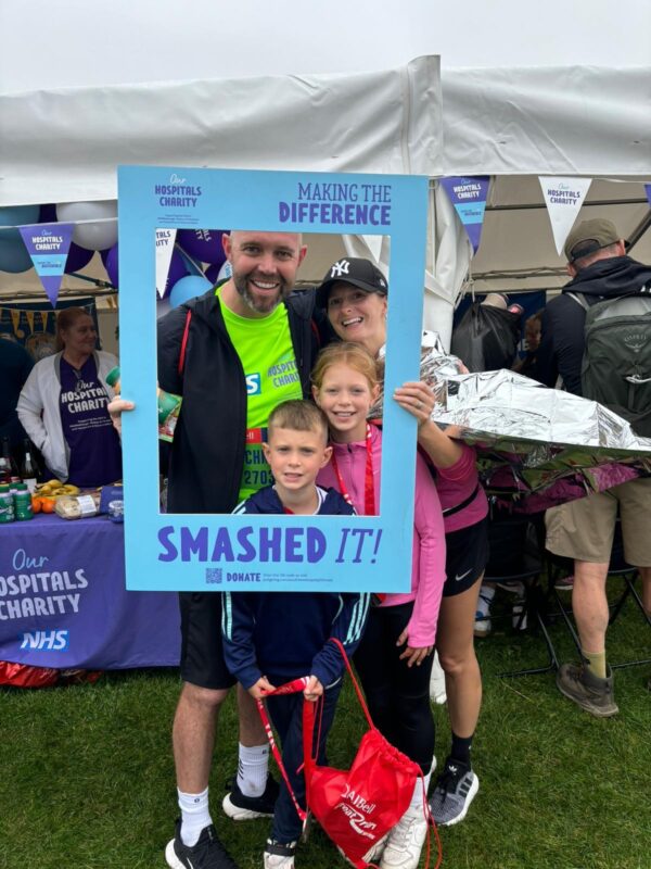 Chris, Sarah and their children in selfie frame