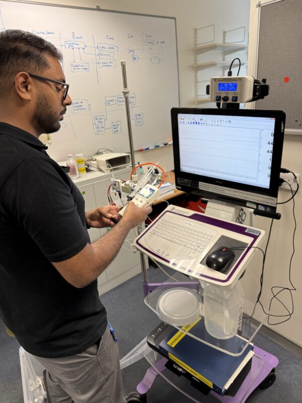 Assistant clinical technologist performing testing.