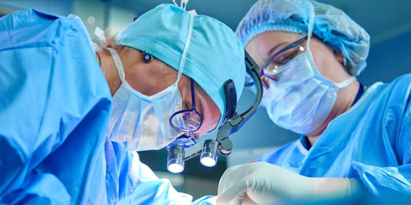 Close up of surgeons in operating theatre