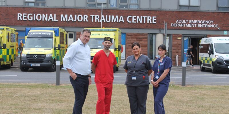 Steve Turner outside James Cook A&E with hospitalstaff