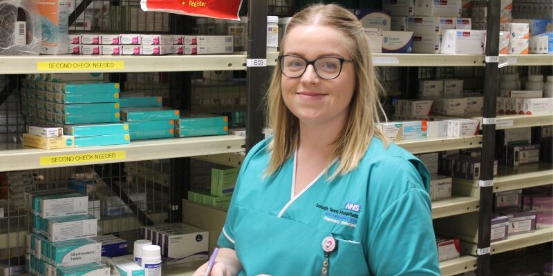 Katie sorting through medication in the dispensary.