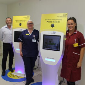 (Left to right) Jay Garrett, digital programme manager, Maxine Stephens ward manager and HCA Lindsey Painter with the self-check-in kiosks